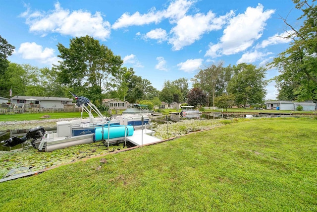 view of yard with a dock