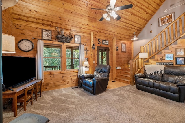 carpeted living room featuring ceiling fan, wood walls, wooden ceiling, and high vaulted ceiling