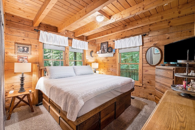 bedroom with wood walls, wooden ceiling, and multiple windows