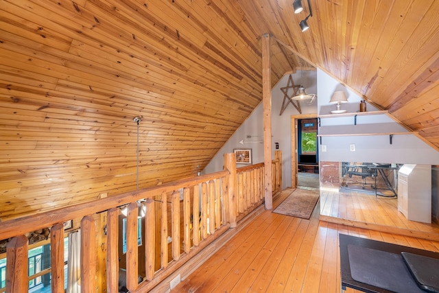 hallway featuring wooden ceiling, wooden walls, and light hardwood / wood-style flooring