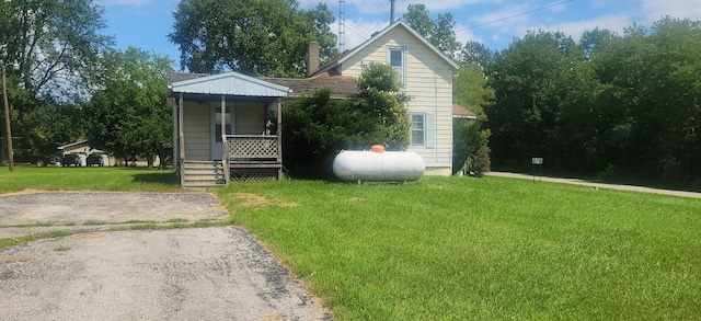 3150 Swaffer Rd, Millington, MI 48746 - view of front facade with a front yard and covered porch