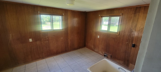 3150 Swaffer Rd, Millington, MI 48746 - spare room featuring wood walls and light tile patterned floors