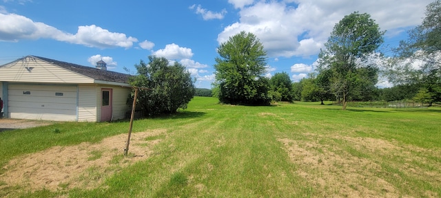3150 Swaffer Rd, Millington, MI 48746 - view of grassy yard with a garage