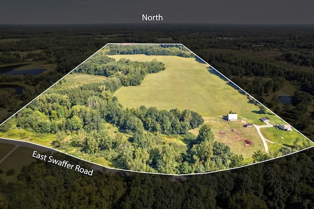 3150 Swaffer Rd, Millington, MI 48746 - aerial view of property and surrounding area featuring a heavily wooded area and property boundaries highlighted