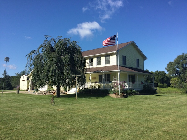 exterior space with a yard and a porch