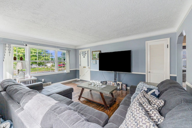 living room with hardwood / wood-style floors and a textured ceiling