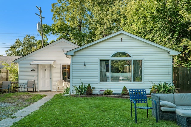 view of front of home with a front lawn