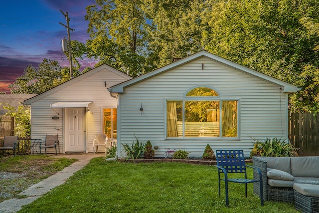 view of front of house with a yard