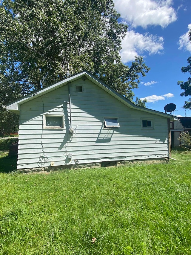 view of property exterior featuring a yard