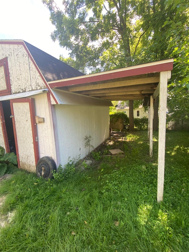 view of parking featuring a yard