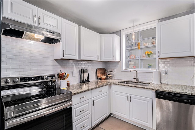 kitchen with tasteful backsplash, white cabinetry, sink, and appliances with stainless steel finishes