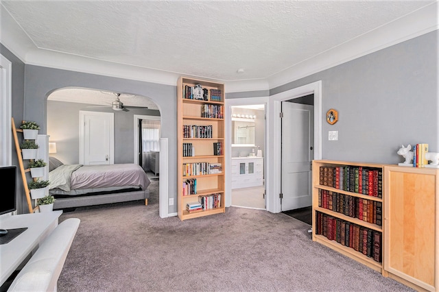 carpeted bedroom featuring a textured ceiling