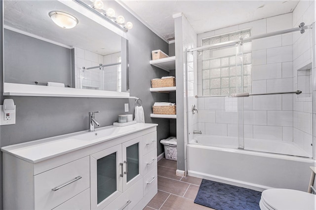 full bathroom with vanity, enclosed tub / shower combo, and toilet