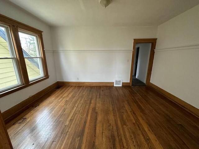 121/123 Sturtevant St, Highland Park, MI 48203 - unfurnished bedroom with wood-type flooring and baseboards