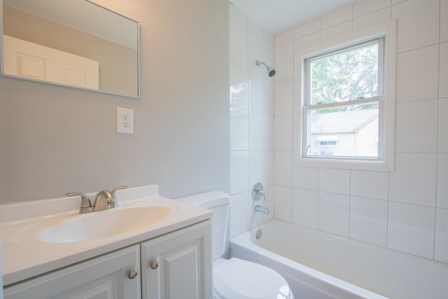 full bathroom with vanity, toilet, and tiled shower / bath