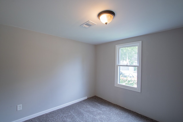 unfurnished room featuring carpet