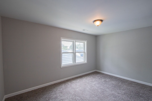 unfurnished room with carpet floors