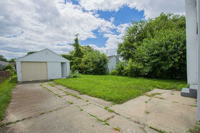 exterior space with an outbuilding and a garage