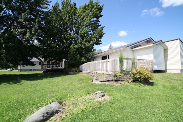 view of yard featuring a wooden deck