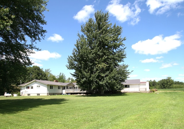 view of yard with a wooden deck