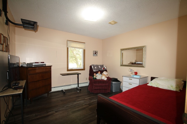 bedroom featuring a textured ceiling, dark hardwood / wood-style flooring, and baseboard heating