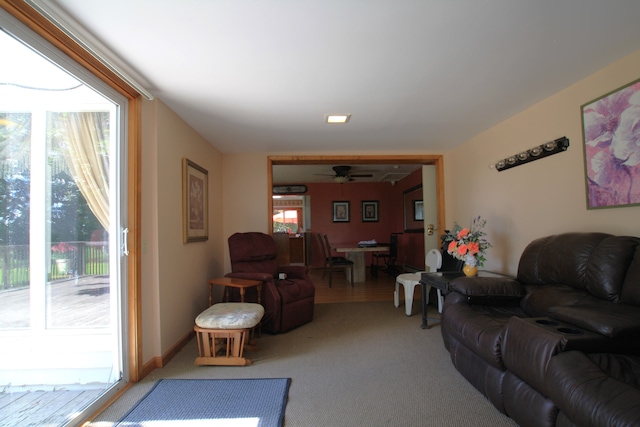 living room featuring ceiling fan and carpet floors