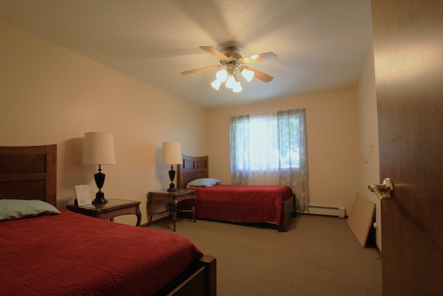 carpeted bedroom featuring ceiling fan and a baseboard radiator