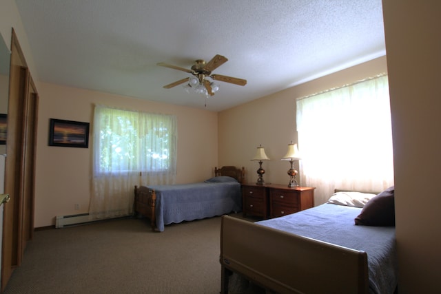 carpeted bedroom featuring a textured ceiling, ceiling fan, and baseboard heating