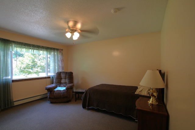 carpeted bedroom featuring a textured ceiling, ceiling fan, and baseboard heating