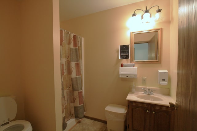 bathroom featuring a shower with shower curtain, tile patterned floors, vanity, and toilet