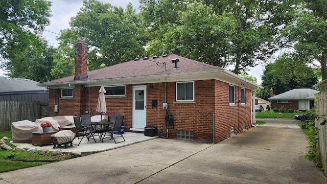 back of property featuring a patio area