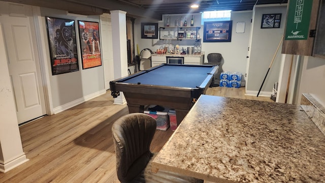 recreation room with indoor bar, light wood-type flooring, and pool table