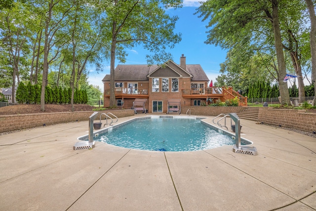 12120 Shaffer Rd, Davisburg, MI 48350 - view of pool featuring a wooden deck, a patio area, and stairs