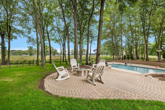 view of patio with a fenced in pool