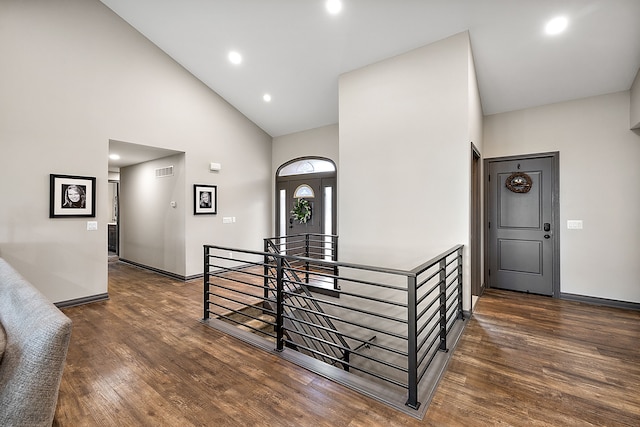 12120 Shaffer Rd, Davisburg, MI 48350 - stairway featuring high vaulted ceiling, wood finished floors, baseboards, and recessed lighting