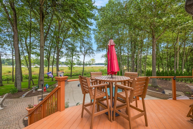 wooden terrace featuring a patio area