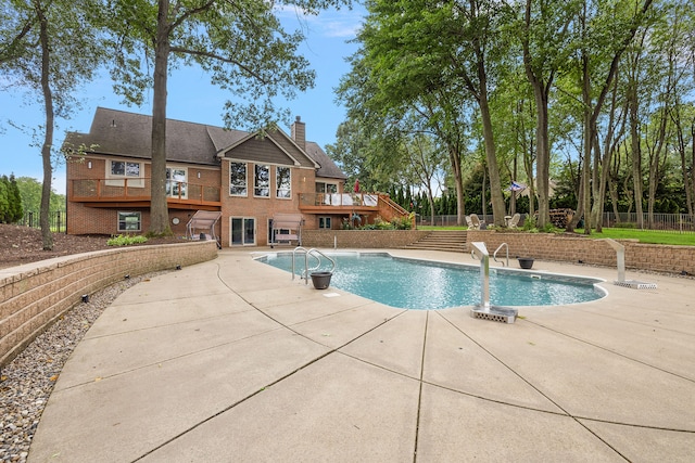 view of swimming pool with a patio area