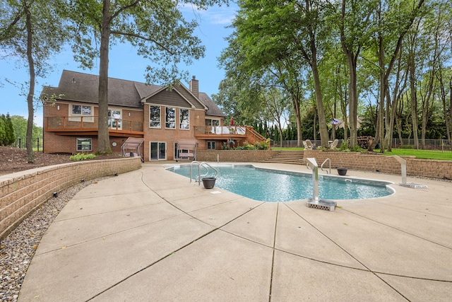 12120 Shaffer Rd, Davisburg, MI 48350 - view of swimming pool with a wooden deck and a patio