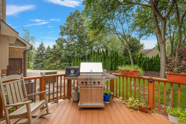 wooden terrace with a yard