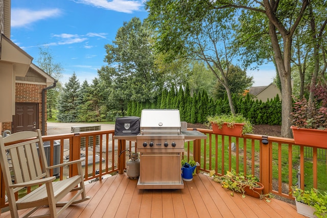 12120 Shaffer Rd, Davisburg, MI 48350 - wooden deck featuring a grill
