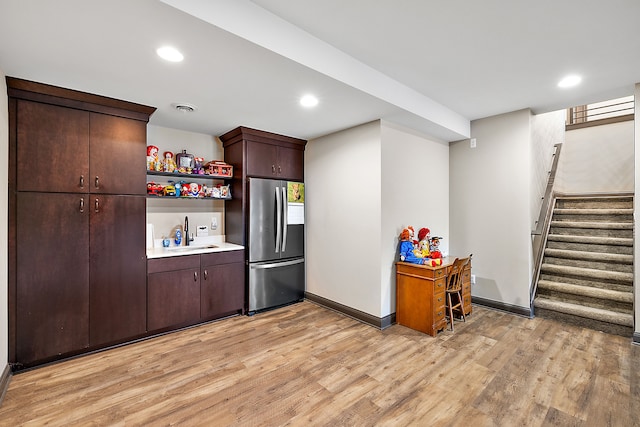 12120 Shaffer Rd, Davisburg, MI 48350 - kitchen featuring stainless steel refrigerator, a sink, light wood finished floors, baseboards, and dark brown cabinetry