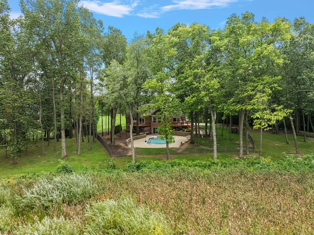 12120 Shaffer Rd, Davisburg, MI 48350 - view of grassy yard with a wooden deck and a patio area