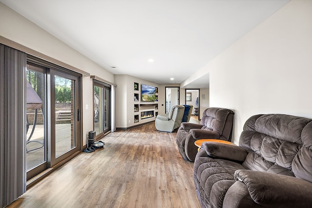 12120 Shaffer Rd, Davisburg, MI 48350 - living room featuring wood finished floors, baseboards, and recessed lighting