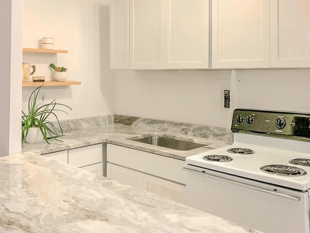 kitchen featuring white cabinetry, white range with electric stovetop, light stone counters, and open shelves
