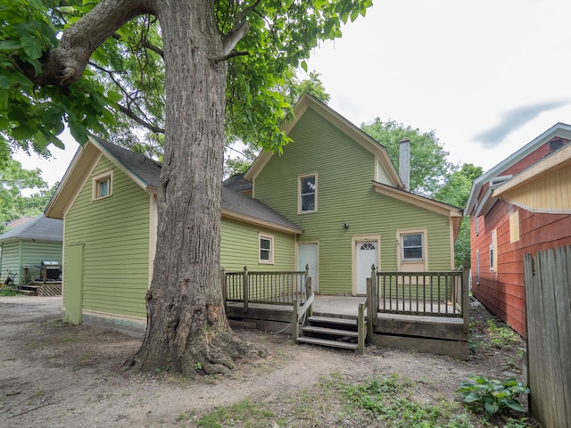 935 Osborne St, Kalamazoo, MI 49001 - rear view of house with a wooden deck and a chimney