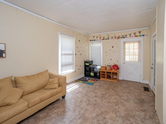 935 Osborne St, Kalamazoo, MI 49001 - living room featuring ornamental molding and healthy amount of natural light