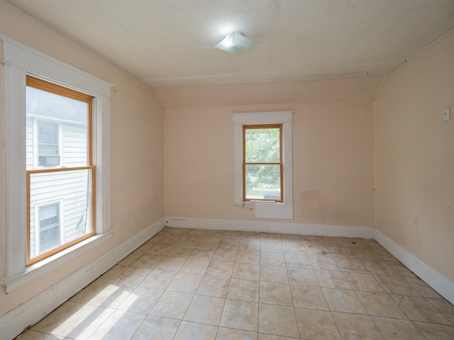 935 Osborne St, Kalamazoo, MI 49001 - empty room featuring baseboards and vaulted ceiling