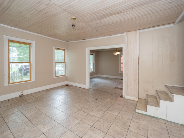 935 Osborne St, Kalamazoo, MI 49001 - unfurnished room with light tile patterned floors, wood ceiling, ornamental molding, stairs, and baseboards