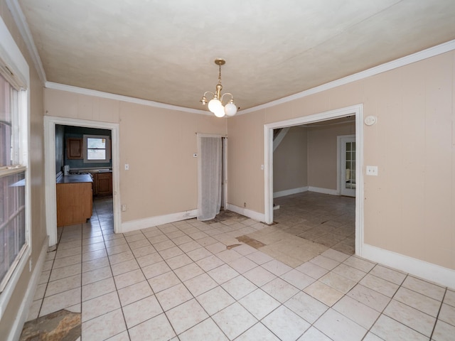 935 Osborne St, Kalamazoo, MI 49001 - unfurnished room featuring ornamental molding, a chandelier, and light tile patterned floors