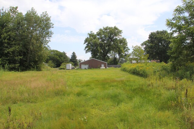 50741 N Ave, Macomb, MI 48042 - view of yard with a detached garage and an outbuilding